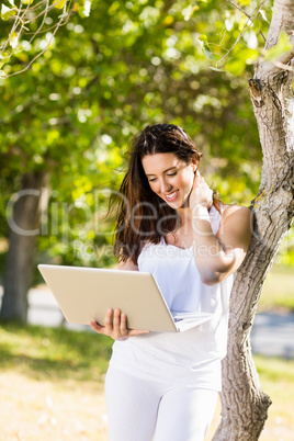 Happy woman using laptop