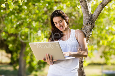 Happy woman using laptop