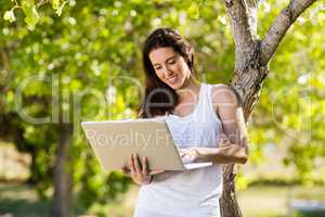 Happy woman using laptop