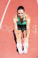 Portrait of female athlete doing stretching exercise