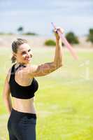 Portrait of female athlete about to throw a javelin