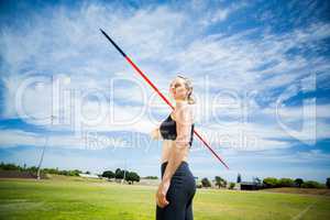 Female athlete about to throw a javelin