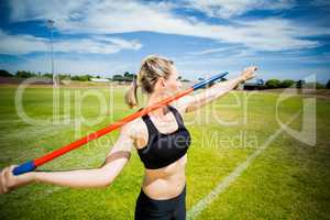 Female athlete about to throw a javelin