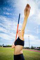 Female athlete about to throw a javelin