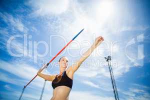 Female athlete about to throw a javelin