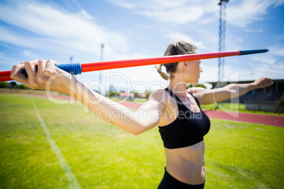 Female athlete about to throw a javelin