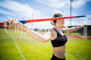 Female athlete about to throw a javelin