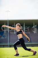 Female athlete about to throw a discus