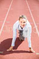 Portrait of businesswoman in ready to run position