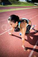 Female athlete in ready to run position