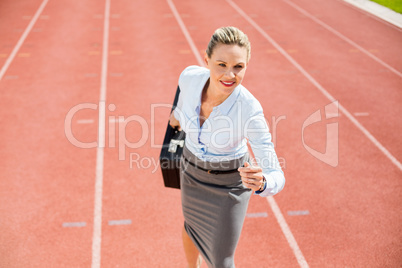 Businesswoman in ready to run position