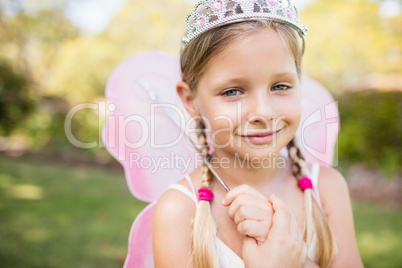 Portrait of cute girl pretending to be a princess