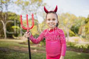 Little girl pretending to be a devil