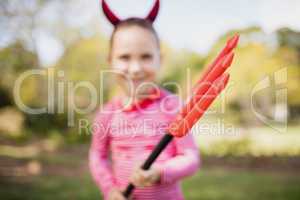 Blurred picture of girl pretending to be devil