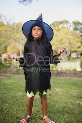 Cute girl pretending to be a witch