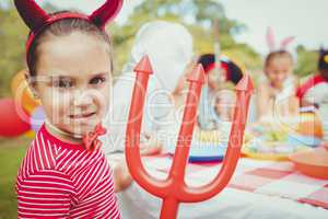 Adorable girl wearing a costume during a birthday party