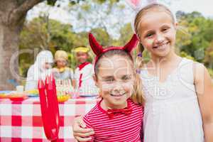 Smiling girls wearing costume during a birthday party