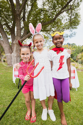 Three girls wearing costume posing for the camera