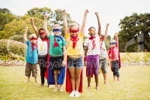 Children wearing superhero costume standing