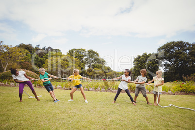 Children pulling a rope in tug of war