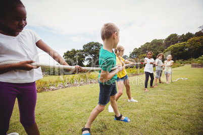 Children pulling a rope in tug of war