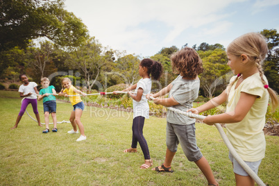 Children pulling a rope in tug of war