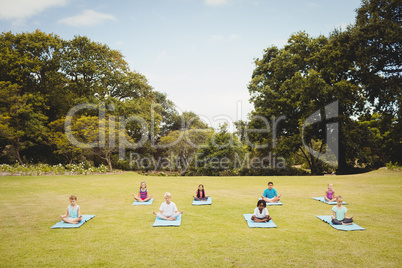 Distant view of children doing yoga