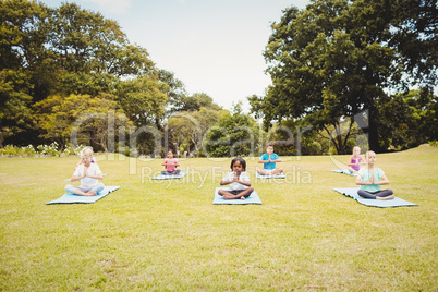 Front view of children doing yoga