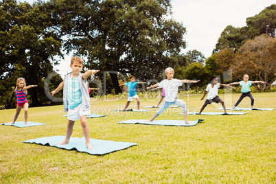 Front view of children doing yoga