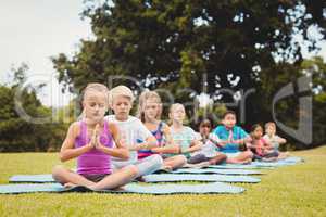 Front view of children doing yoga