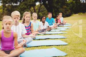 Front view of children doing yoga