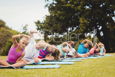 Front view of children doing yoga