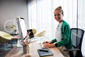 Casual businesswoman using a computer