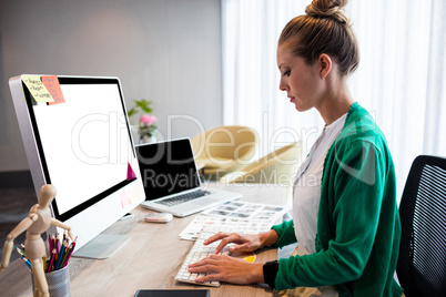 Casual businesswoman using a computer