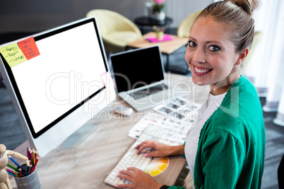 Casual businesswoman using a computer