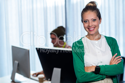 Businesswoman posing front of her coworker