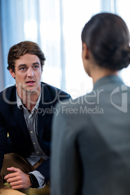Businessman interacting with a businesswoman