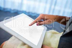 Close up of hand using a tablet