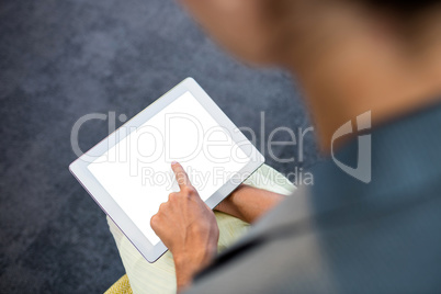 Focus on background of hand using a tablet