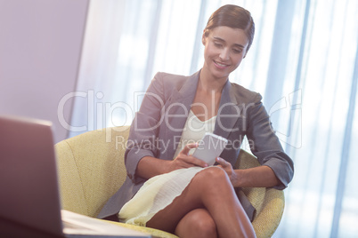 Businesswoman using a phone