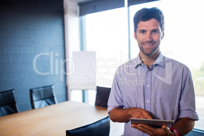 Casual businessman using a tablet
