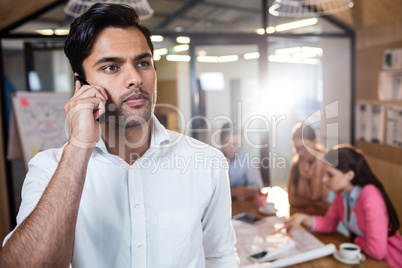 Casual businessman making a phone call