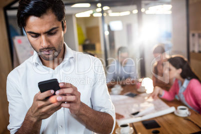 Casual businessman using a phone