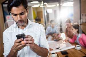 Casual businessman using a phone