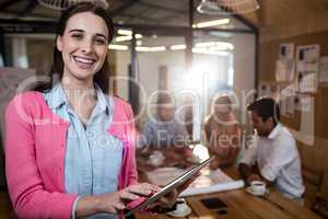 Casual businesswoman using a tablet