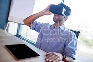 Businessman using virtual reality device