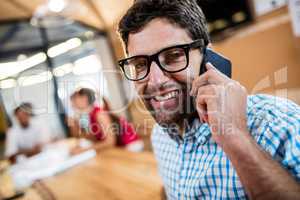 Casual businessman making a phone call