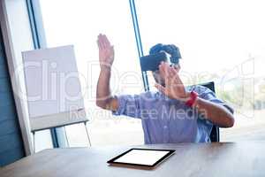 Businessman using virtual reality device