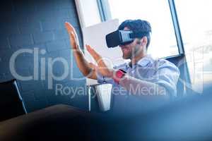 Businessman using virtual reality device