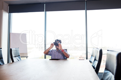 Businessman using virtual reality device